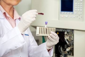 Poster - Scientist Analyzing Blood Sample In Laboratory