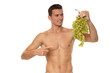 © petrdlouhy - Athletic young man shirtless holds and shows you in grapes