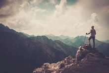 Woman Hiker On A Top Of A Mountain