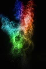 Wall Mural - colourful powder exploding isolated on black