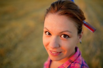 Portrait of beautiful young girl with two screw in a hairdress