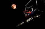 Fototapeta Sport - Basketball on  black background with light effect