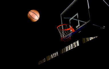 Wall Mural - Basketball on  black background with light effect