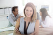 © goodluz - Portrait of beautiful woman attending business meeting