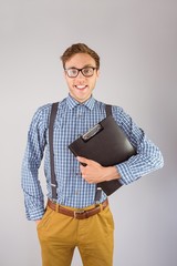 Poster - Geeky businessman holding a clipboard