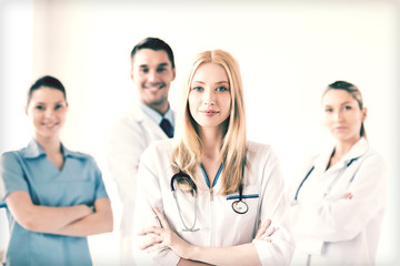 Wall Mural - female doctor in front of medical group