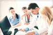 © Syda Productions - team or group of doctors working