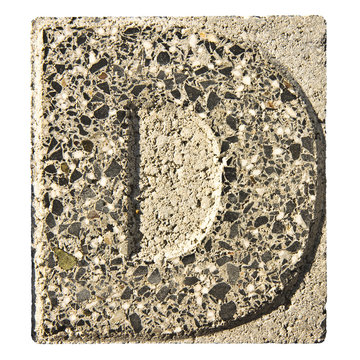 Letter D carved in a concrete block