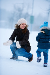 Canvas Print - Mother and daughter outdoors at winter