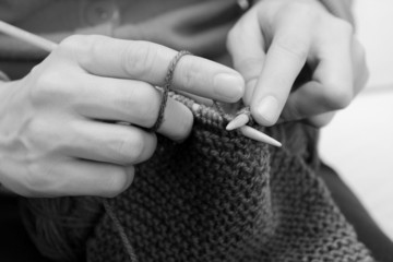 Wall Mural - Closeup of woman knitting with wool