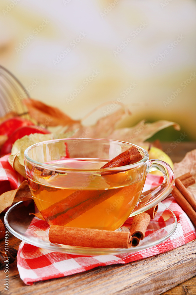 Apple cider with cinnamon sticks and fresh apples