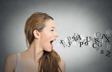 woman talking with alphabet letters coming out of mouth
