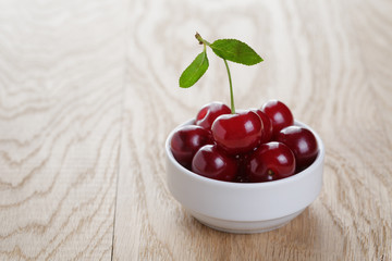 Wall Mural - cherry berries in white bowl