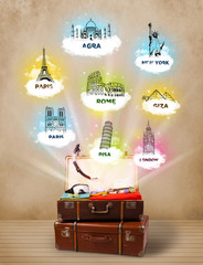 Wall Mural - Tourist suitcase with famous landmarks around the world