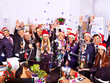 Group people in santa hat at Xmas business party.