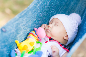 Cute little baby sleeping in the park