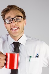 Poster - Young geeky businessman holding mug