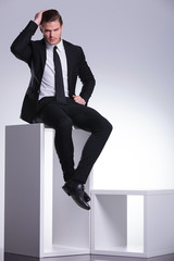 business man sitting on a modern white furniture