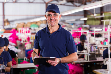 Wall Mural - senior factory supervisor with clipboard