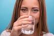 © zinkevych - Portrait of young beautiful girl drinking clean water from a gla
