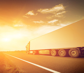 Canvas Print - Truck on asphalt road motion blur