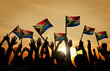 © Rawpixel.com - Group of People Waving South African Flags in Back Lit