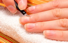 Woman Trimming Cuticles Of Hand, Manicure