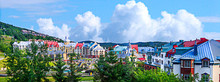 Mont Tremblant Village In Blue Sky And Clouds.