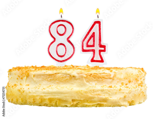 Poster birthday cake with candles number eighty four isolated on white