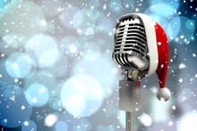 Composite Image Of Microphone With Santa Hat