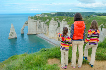 mother and kids looking at beautiful sea view, family hiking