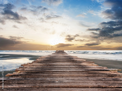 Fototapeta na wymiar Pier at beach on twilight time