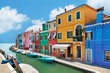 colorful houses by the water canal at the island Burano
