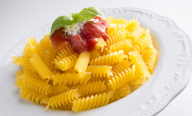 dish with macaroni and tomato sauce isolated on white background