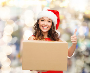 Sticker - smiling woman in santa helper hat with parcel box