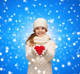 Poster - dreaming girl in winter clothes with red heart