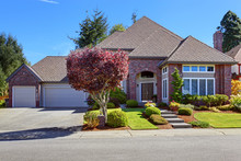 Luxury House With Brick Wall Trim And Beautiful Curb Appeal
