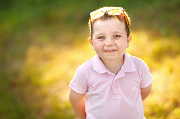 Portrait of cute little boy  in summer