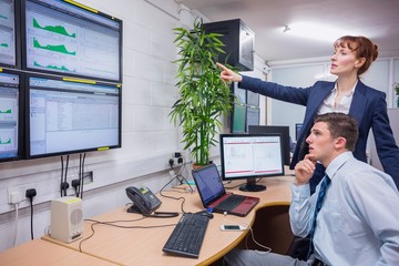 Poster - Focused colleagues analyzing result on their computer