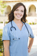 © Andy Dean - Proud Young Adult Woman Doctor or Nurse Portrait Outside