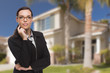© Andy Dean - Mixed Race Woman in Front of Residential House