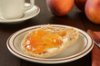 English muffin with peach jam