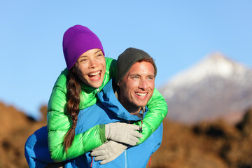 Canvas Print - Couple piggyback happy in active lifestyle