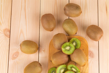 Sticker - Close up of sliced kiwi on wood table.