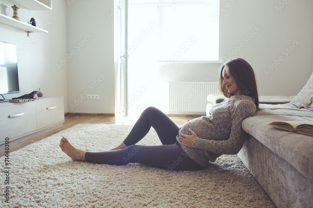 Home portrait of pregnant woman