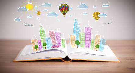 Fototapete - cityscape drawing on open book