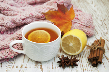 Poster - Cup of hot tea with lemon and scarf