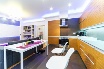 interior of modern kitchen with table and chairs