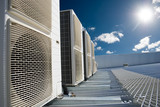 Fototapeta  - Air conditioner units with sun and blue sky