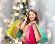 © Syda Productions - smiling woman with colorful shopping bags
